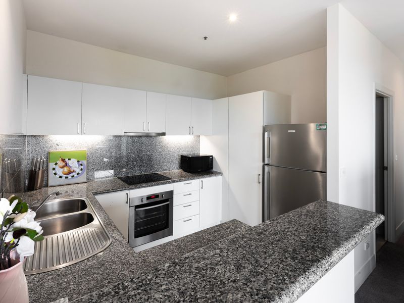 Fully equipped kitchen with appliances and generous bench space