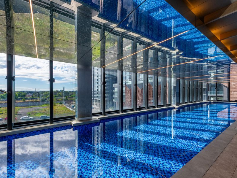 Well-maintained communal pool in a peaceful complex setting