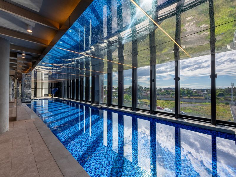 Spacious shared pool area with sun lounges for relaxing afternoons