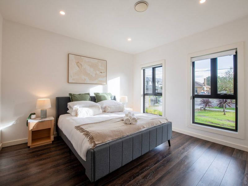 Beautifully styled King bedroom featuring natural light and a peaceful atmosphere.