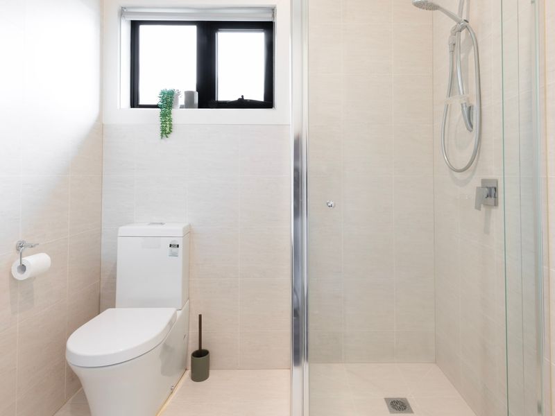 Fresh ensuite bathroom with walk-in shower and amenities for your convenience.