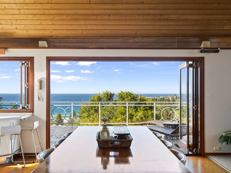 Where shared meals meet expansive terrace views and airy surroundings.
