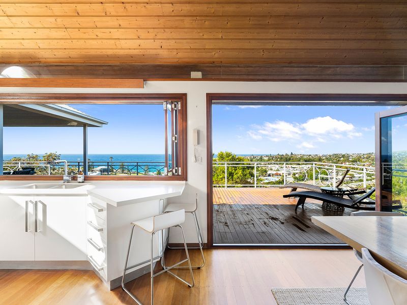 A seamless blend of kitchen comfort and a spacious terrace opening to endless ocean and sky views.