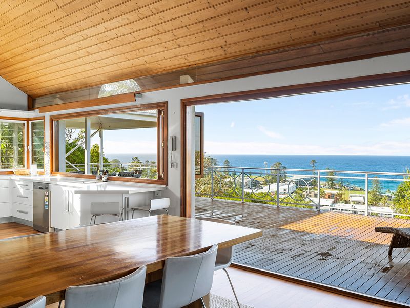 Kitchen spaces designed for coastal living, paired with breathtaking ocean views.