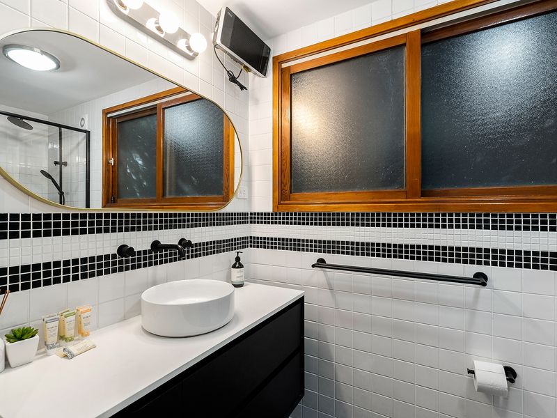 A sophisticated bathroom vanity space designed with simplicity and style.
