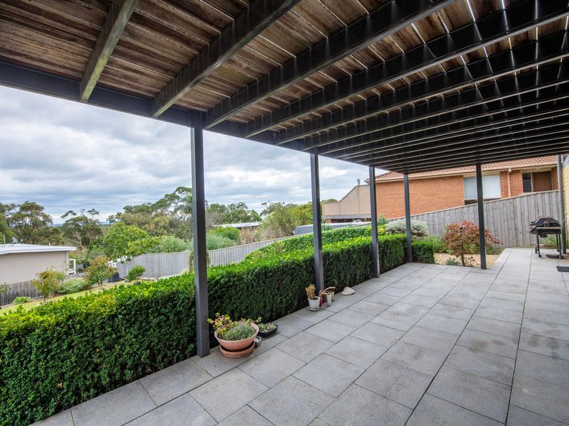 Private outdoor entertaining space surrounded by treetop views