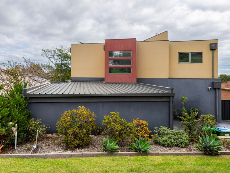 Contemporary exterior with double garage and landscaped gardens.