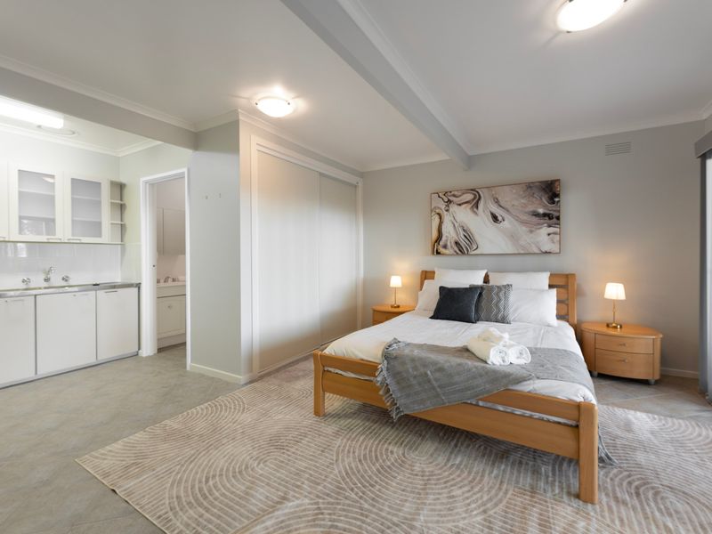 Comfortable queen bedroom with soft styling