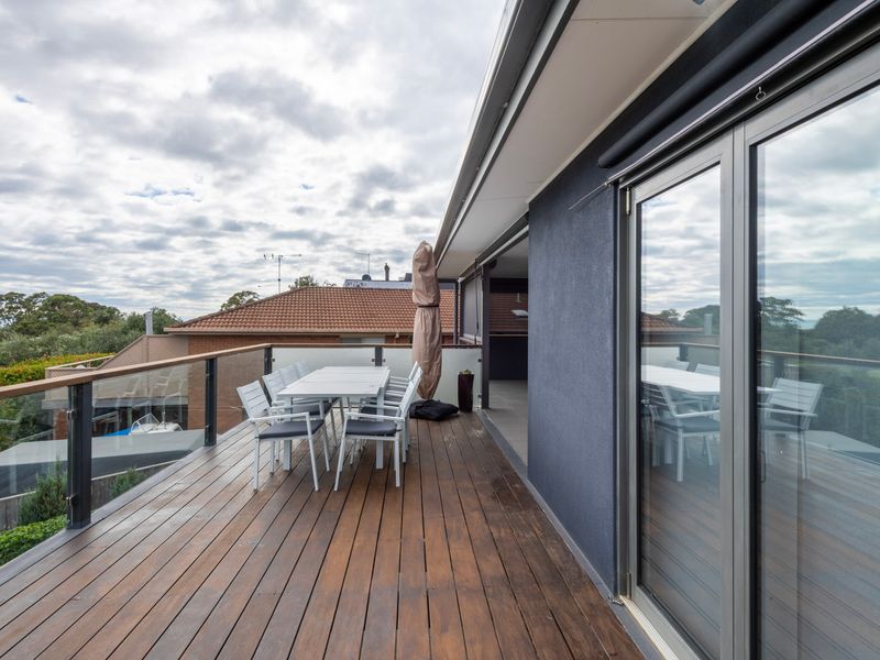 Private outdoor entertaining space surrounded by treetop views