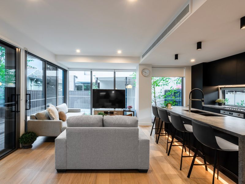 Light-filled living area designed for comfort, relaxation, and group connection