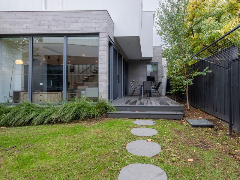 Private outdoor garden space surrounded by greenery.