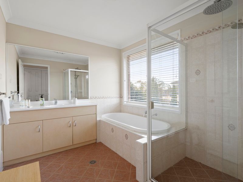 The family bathroom includes both a separate bathtub and shower for added convenience.