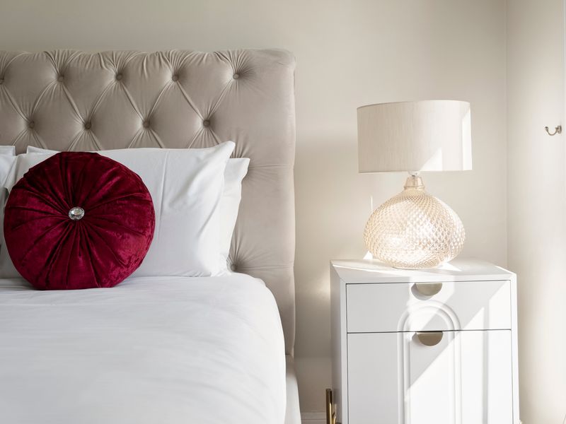 A stylish bedside lamp adds warmth and ambience to the bedroom.