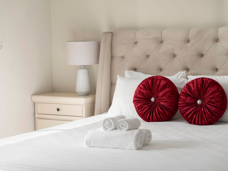 Quality linens and stylish décor create a luxurious bedroom setting.