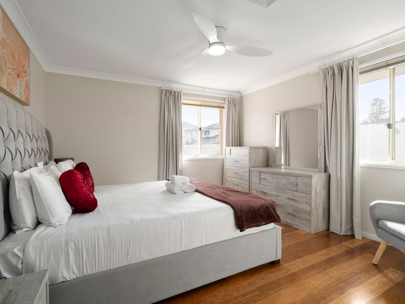 Wake up to natural light in this beautifully appointed bedroom.