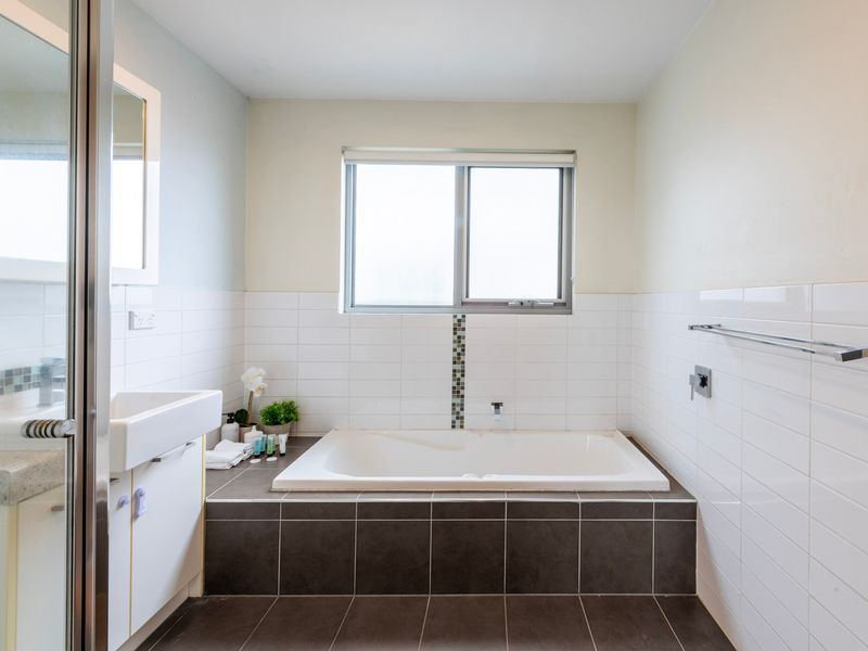 Main bathroom with bathtub for relaxation