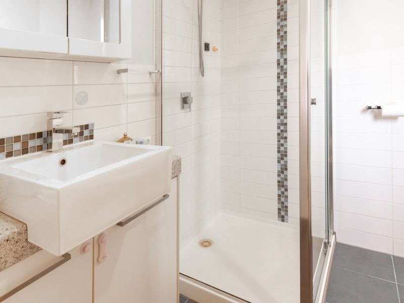 Clean and functional ensuite bathroom with all the essentials for your stay.
