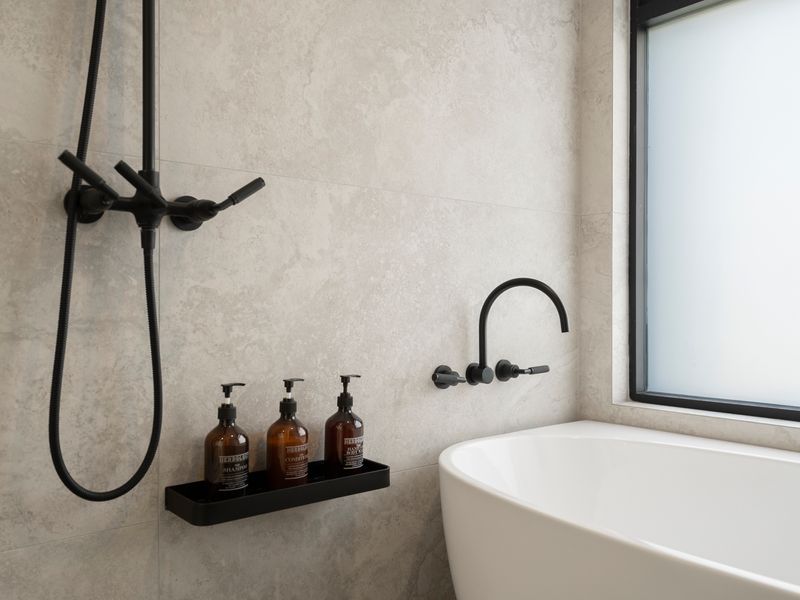 Well-appointed bathroom with shower and bath and quality finishes