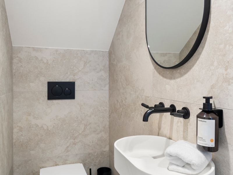 Additional powder room for guest convenience