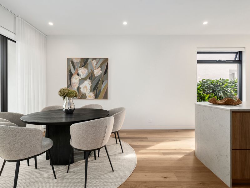 Bright dining area flowing seamlessly to the living space for easy entertaining