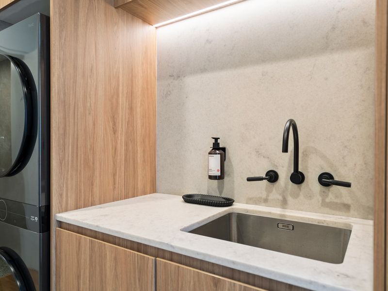 Internal laundry with washing machine and dryer for guest convenience