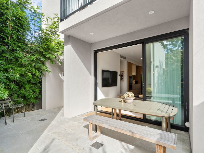 Private outdoor balcony with seating, perfect for morning coffee or evening relaxation