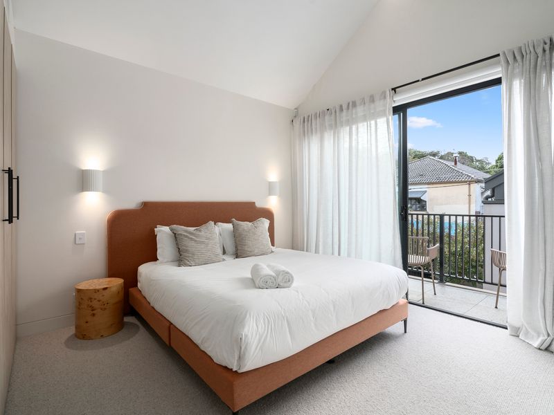 Light-filled bedroom with soft furnishings and private patio