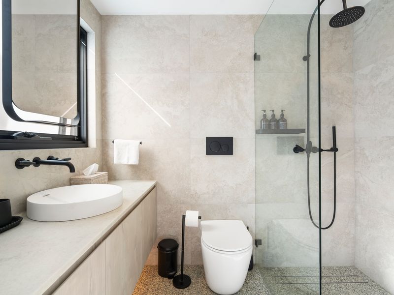 Modern bathroom with walk-in shower and vanity