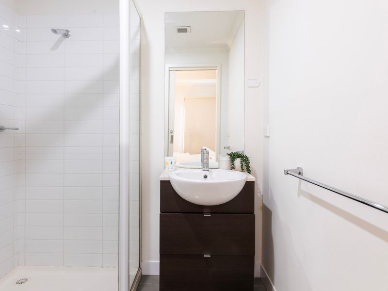 Ensuite bathroom with walk in shower and vanity
