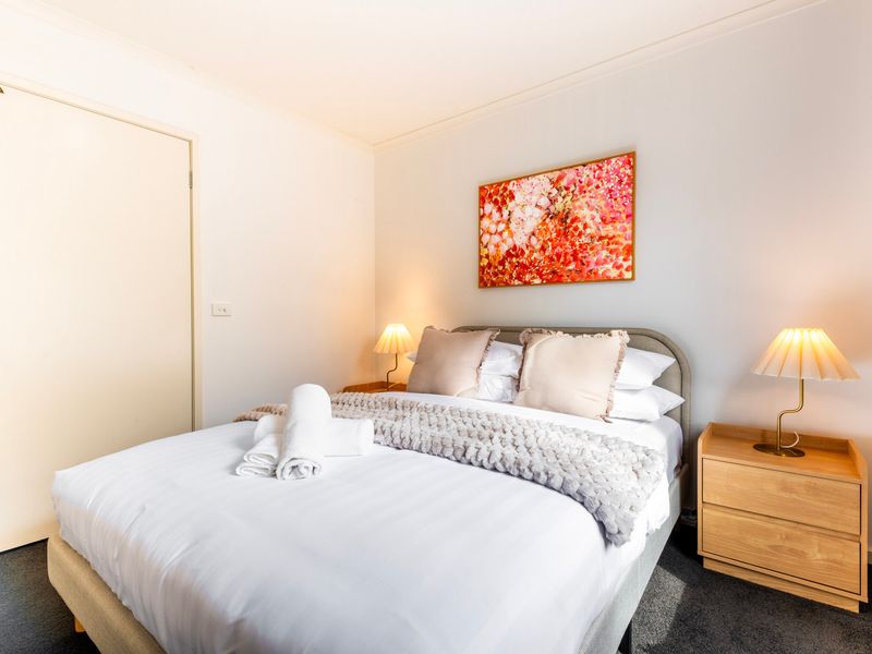 Bright and welcoming bedroom with leafy outlooks