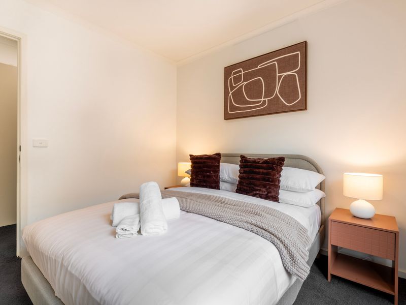 Comfortable queen bedroom with a calm and inviting atmosphere