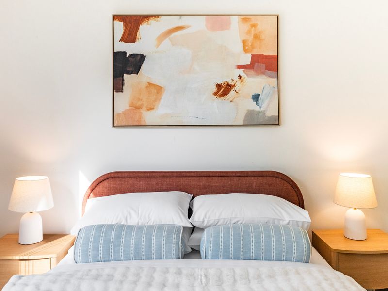 Comfortable queen bedroom designed for a restful night's sleep