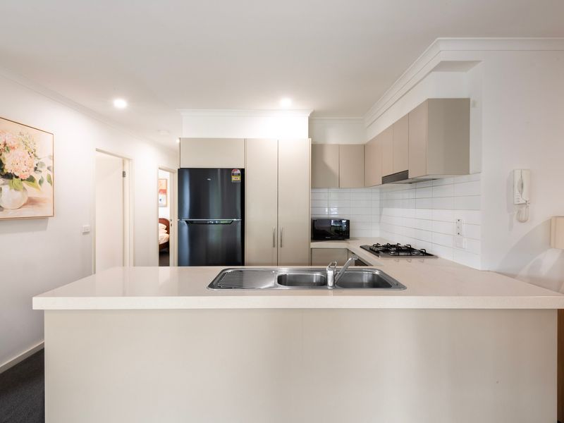 Modern kitchen with stone benchtops and quality appliances
