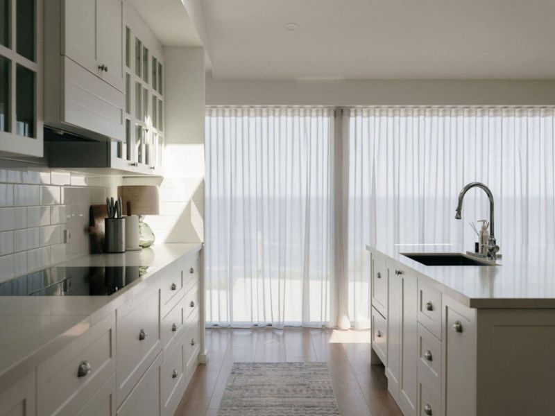 Light-filled kitchen with quality appliances and ample storage.