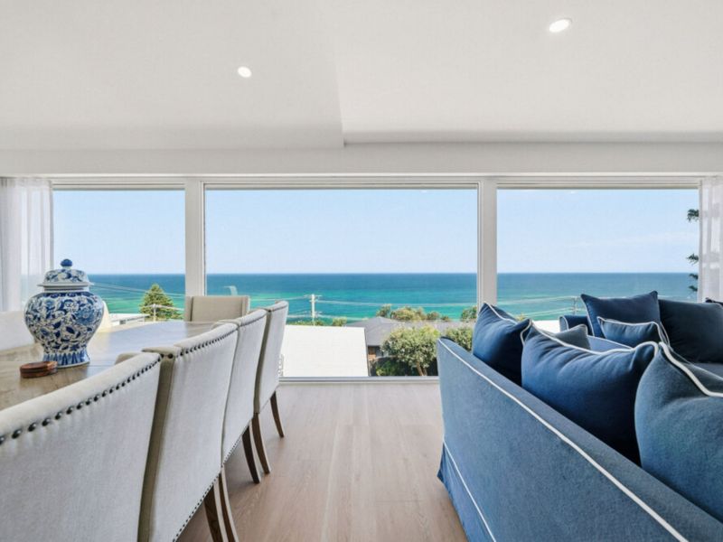 Unwind in a sun-drenched living space inspired by the coast.