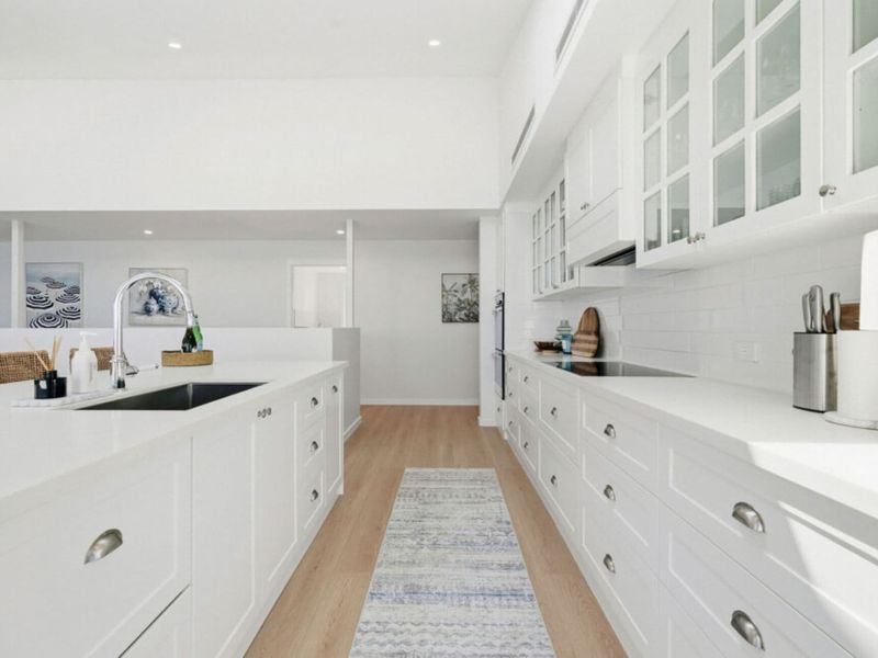 Spacious galley kitchen with extensive storage.