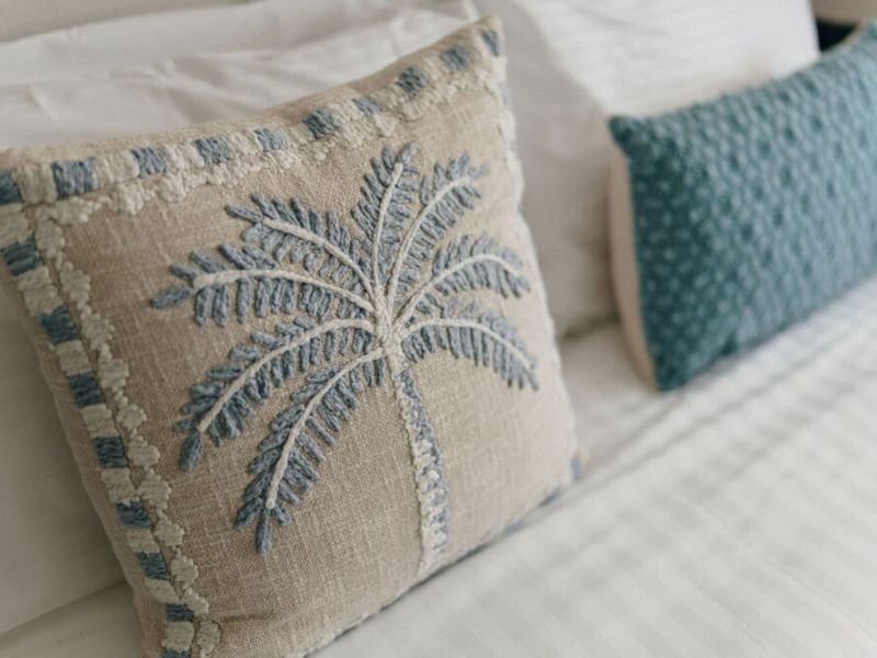Thoughtful coastal accents complete the bedroom styling.