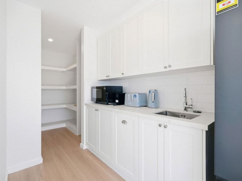Butler's pantry with extra storage and appliance space.