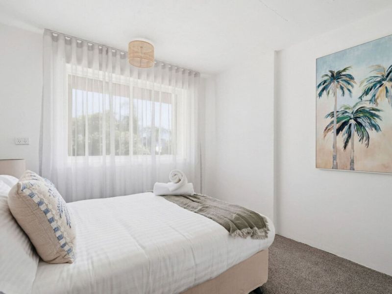 Inviting bedroom with calming coastal-inspired décor.