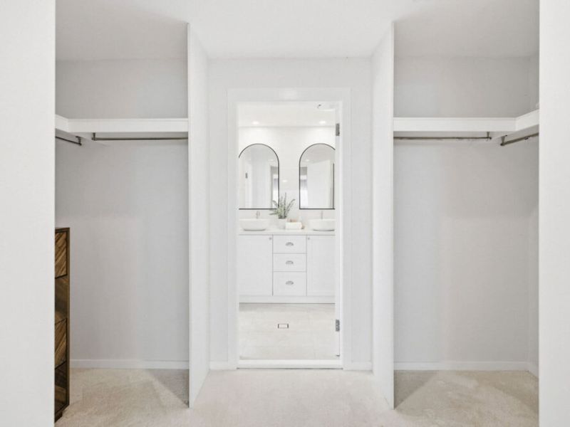 Walk-in wardrobe leading to the ensuite bathroom.