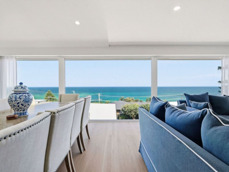 Open-plan living and dining with stunning ocean views.