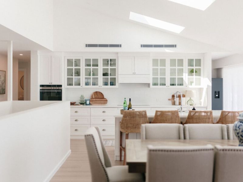 Bright open-plan layout connecting the kitchen and lounge.