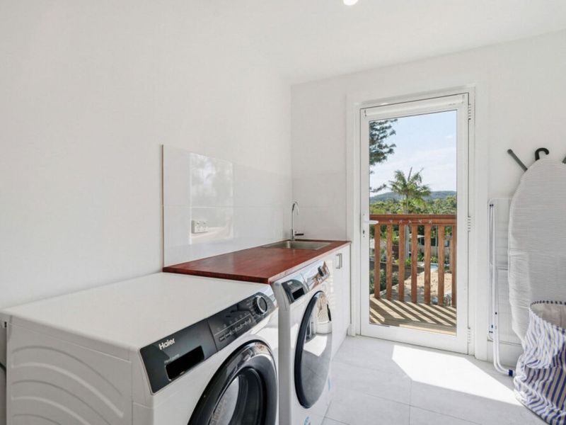 Laundry with washer, dryer and direct outdoor access.