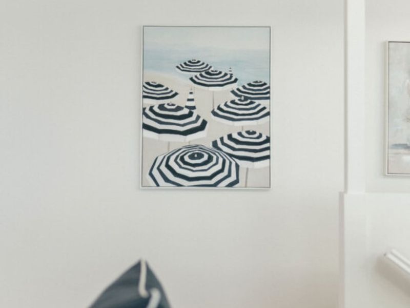 Contemporary artwork complements the bright interior design.