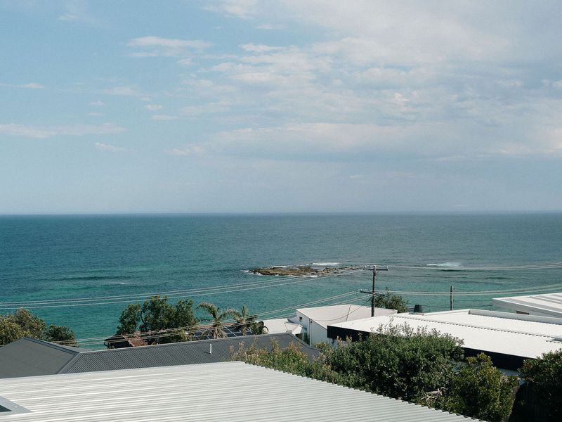 Wake up to endless blue and the soothing sound of the waves.