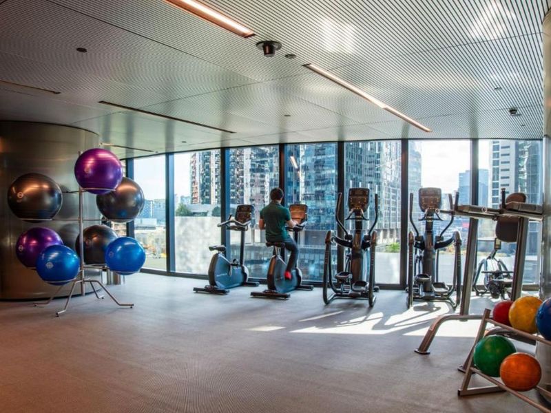 State-of-the-art fitness studio with panoramic city views.