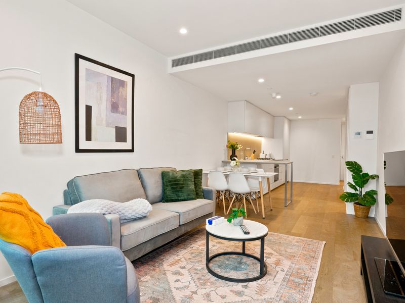 Sophisticated open-plan living with warm designer accents.
