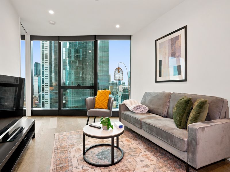 Cozy lounge retreat with floor-to-ceiling windows and plush seating.