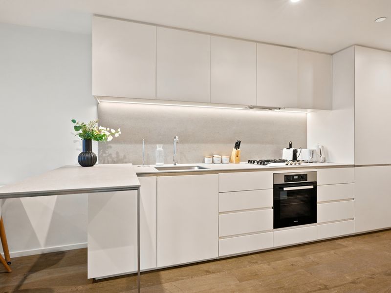Contemporary kitchen featuring premium appliances and minimalist design.