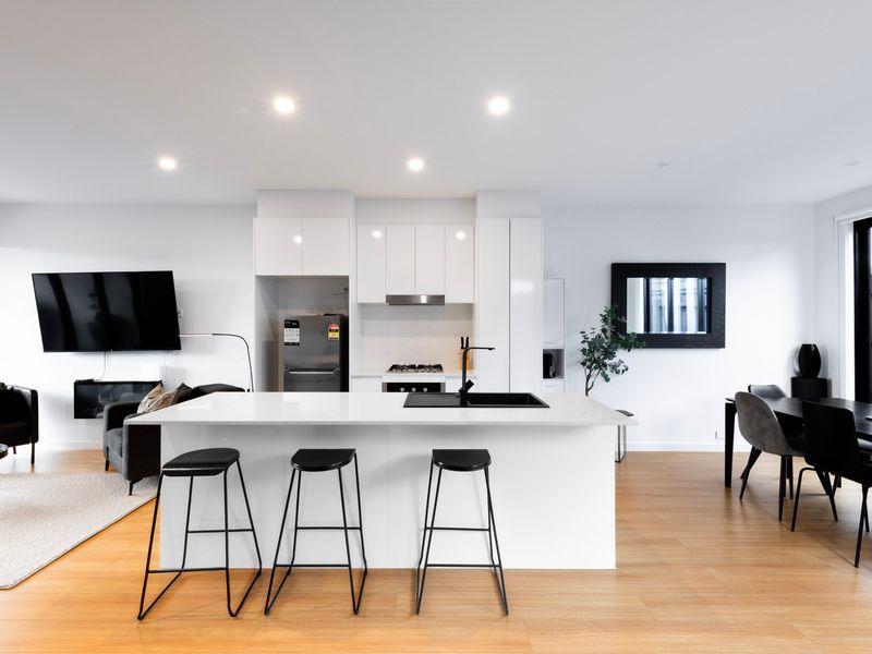 The stylish kitchen is fully equipped with everything you need for home-cooked meals.